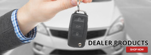 dealer handing over keys to a new car